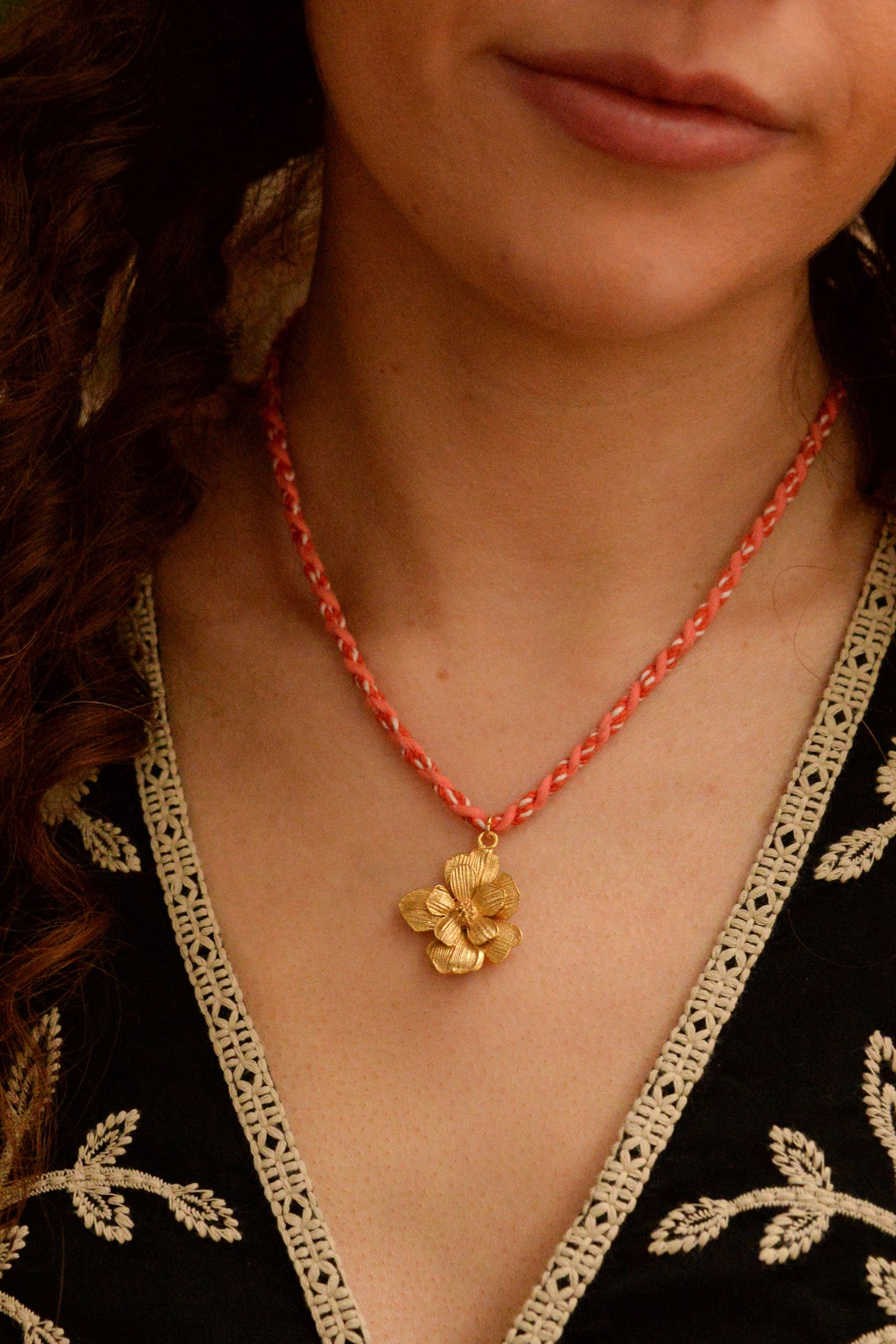 STATEMENT GOLD FLOWER NECKLACE ON PEACH CORD