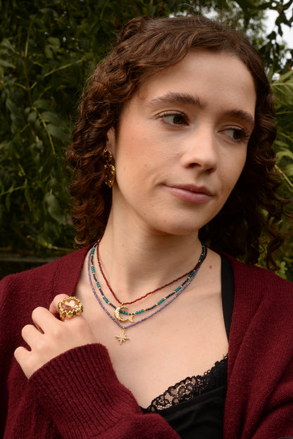 GOLD MOON CHARM ON WINE BEADED NECKLACE