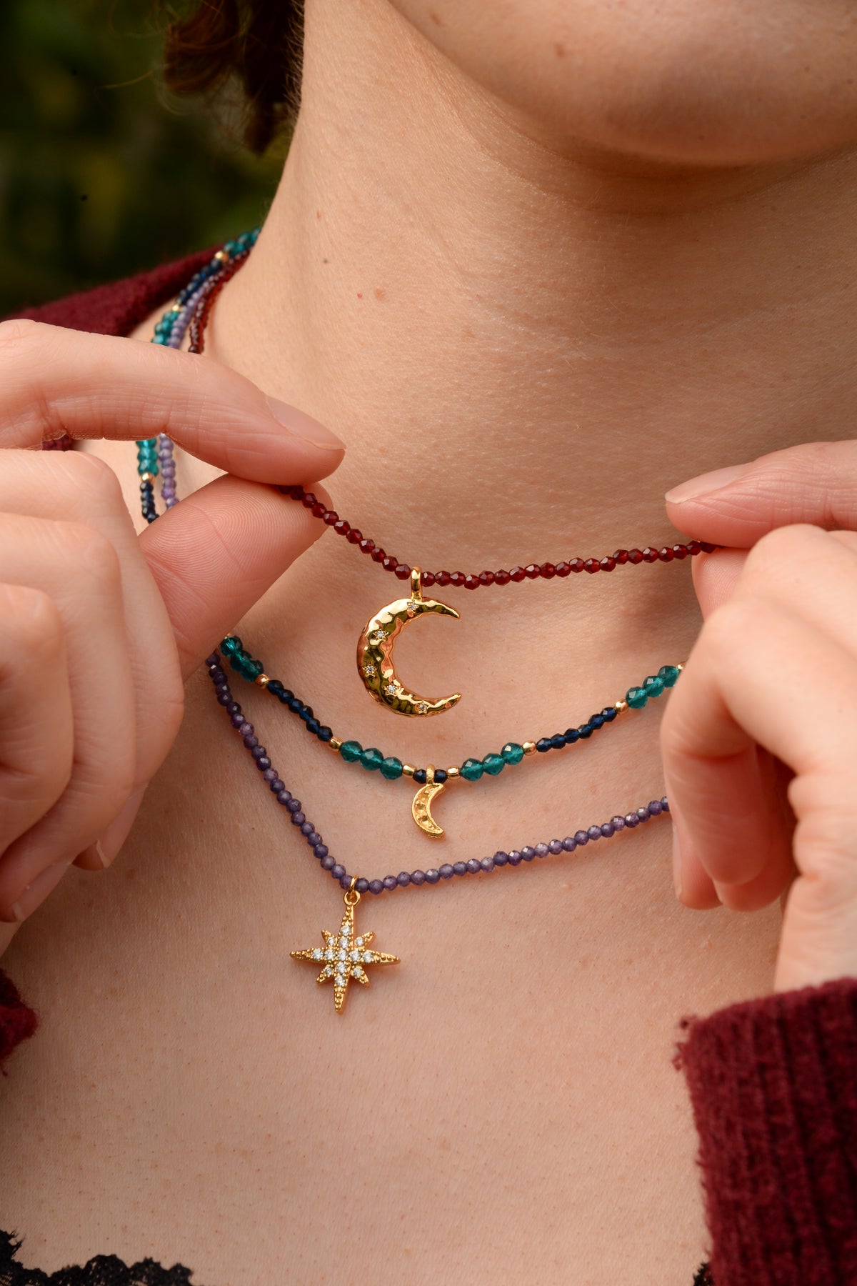 GOLD MOON CHARM ON WINE BEADED NECKLACE