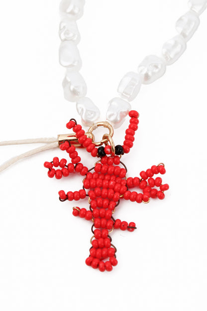PEARL BEAD PHONE CHAIN WITH RED LOBSTER CHARMS